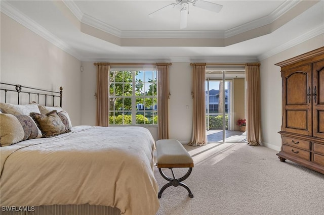 carpeted bedroom featuring access to outside, a raised ceiling, ceiling fan, and crown molding