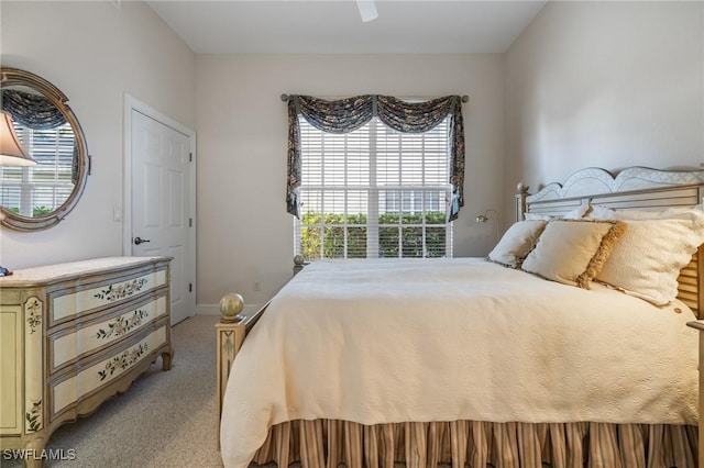 carpeted bedroom with ceiling fan