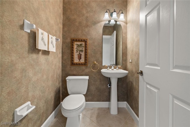 bathroom with tile patterned flooring and toilet