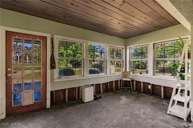 unfurnished sunroom featuring wooden ceiling