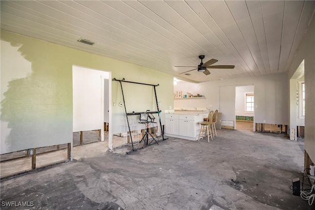 view of patio / terrace with exterior bar and ceiling fan