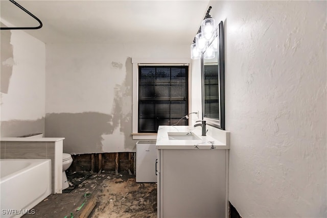 bathroom with a bathtub, vanity, and toilet