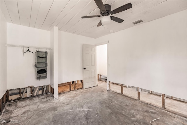 spare room with ceiling fan and wooden ceiling