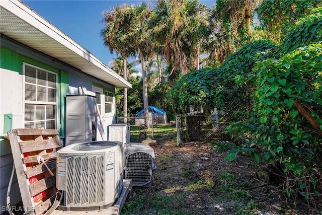 view of yard featuring central AC and ac unit