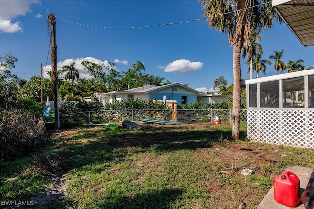 view of yard with a sunroom