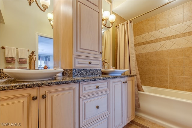 bathroom featuring shower / bathtub combination with curtain and vanity