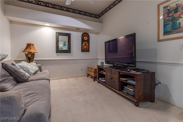 living room with light carpet and ceiling fan