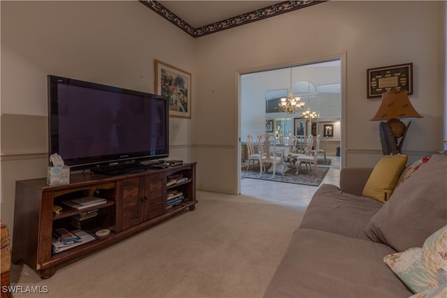 carpeted living room featuring an inviting chandelier