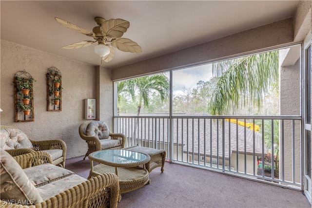 sunroom / solarium featuring ceiling fan