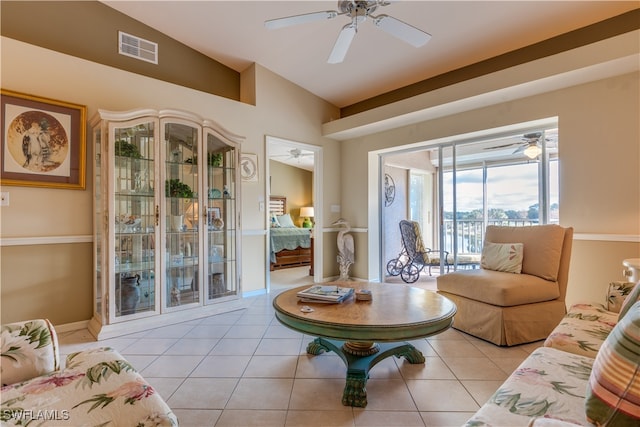 living room featuring light tile patterned floors and lofted ceiling