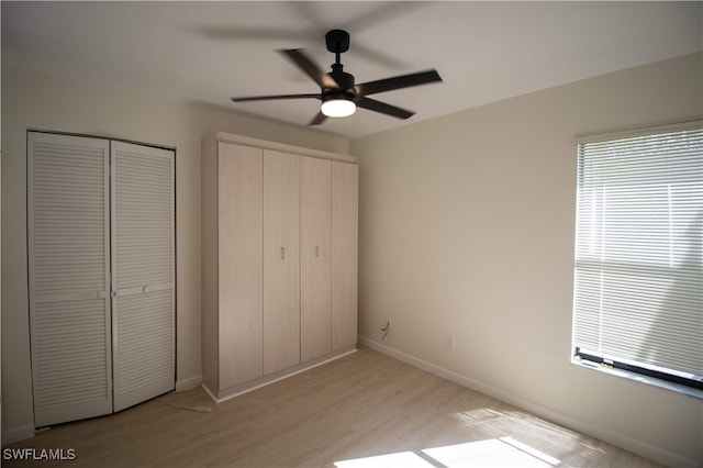 unfurnished bedroom featuring light hardwood / wood-style flooring and ceiling fan