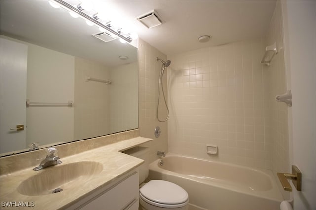 full bathroom featuring vanity, toilet, and tiled shower / bath combo