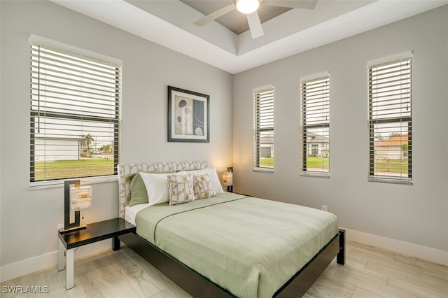 bedroom featuring ceiling fan and light hardwood / wood-style flooring