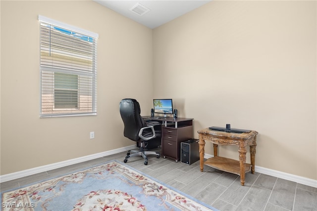 office with light hardwood / wood-style flooring