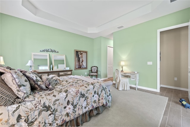 bedroom featuring a tray ceiling