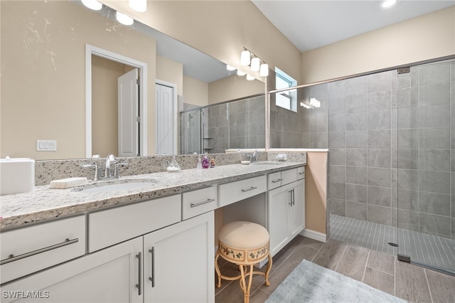 bathroom with vanity and walk in shower