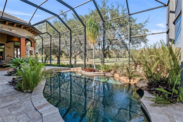 view of pool featuring a lanai