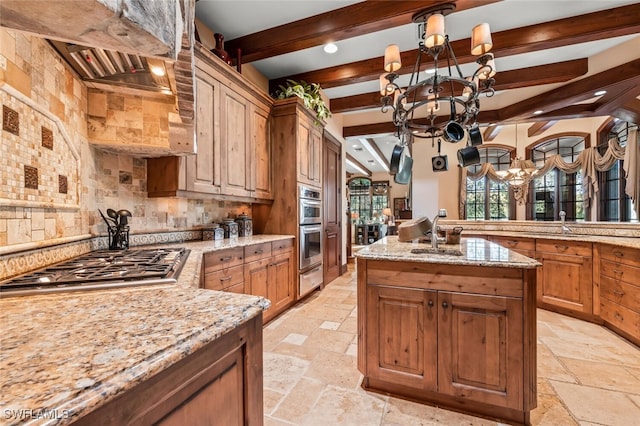 kitchen with light stone countertops, backsplash, stainless steel appliances, beam ceiling, and a chandelier