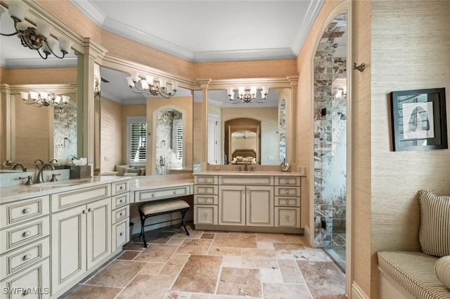 bathroom with vanity, a shower, crown molding, and an inviting chandelier