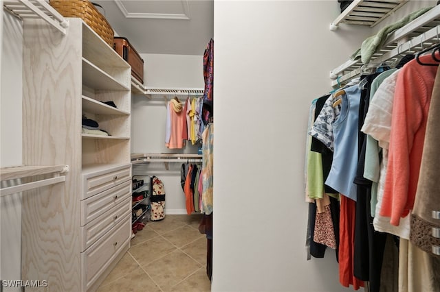 spacious closet featuring light tile patterned floors