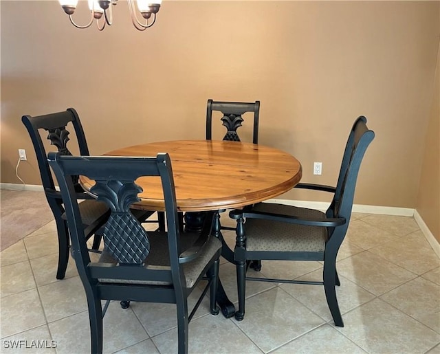 dining room featuring light tile patterned floors and a notable chandelier