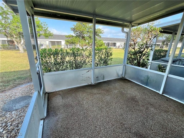 unfurnished sunroom featuring plenty of natural light