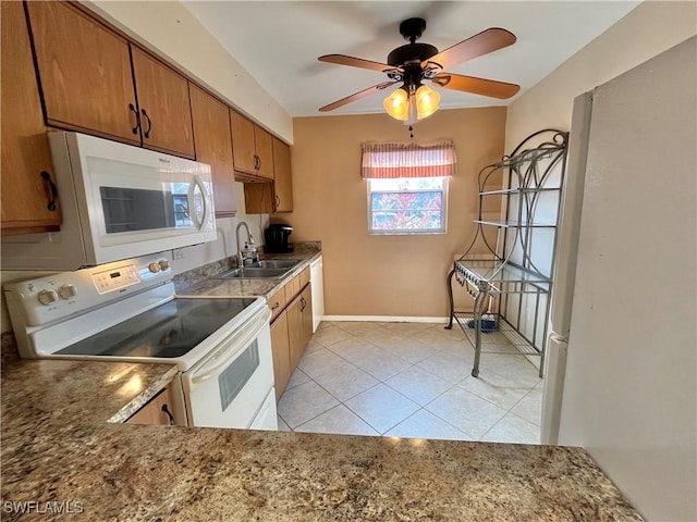 kitchen with ceiling fan, white appliances, sink, and light tile patterned floors