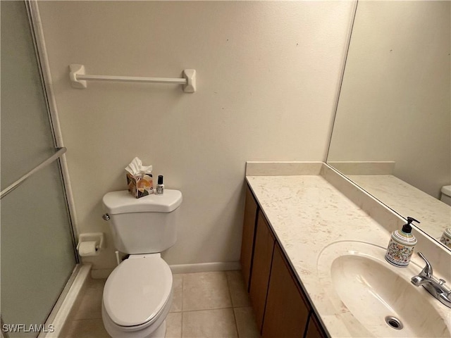 bathroom with walk in shower, tile patterned floors, toilet, and vanity