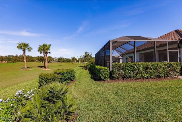 view of yard featuring glass enclosure