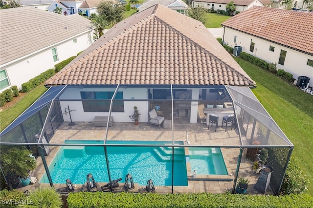 exterior space featuring central AC, a yard, and a patio