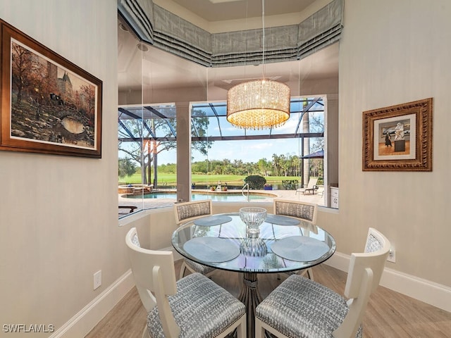 dining room with plenty of natural light and hardwood / wood-style floors