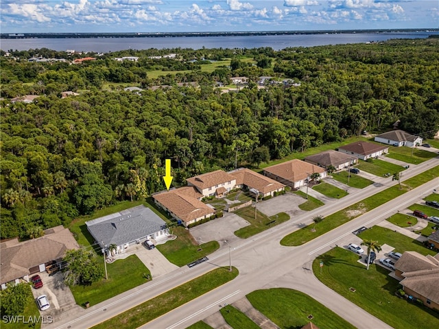 birds eye view of property featuring a water view