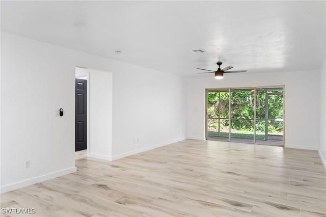 unfurnished room with light hardwood / wood-style flooring and ceiling fan