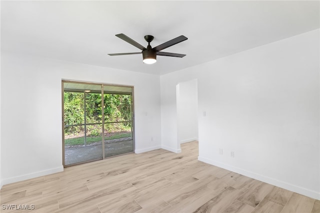 spare room featuring ceiling fan and light hardwood / wood-style flooring