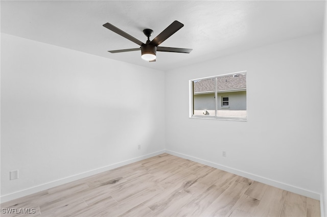 spare room featuring light wood-type flooring and ceiling fan