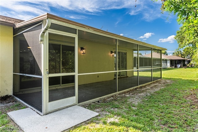 view of side of home featuring a yard