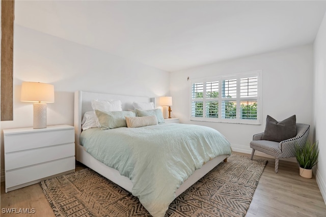 bedroom with light hardwood / wood-style flooring