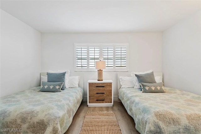 1100 8th Ave S Unit 230K, Naples, FL 34102 - bedroom with wood finished floors