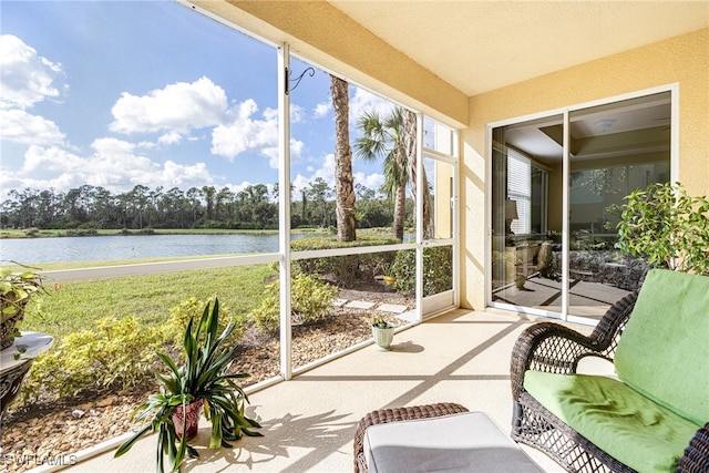 sunroom / solarium with a water view