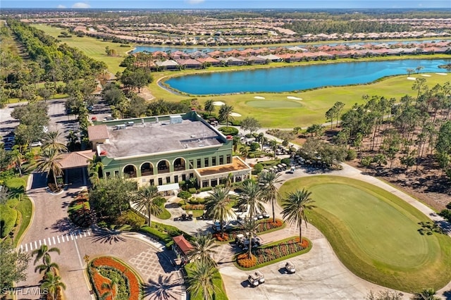 bird's eye view with view of golf course and a water view