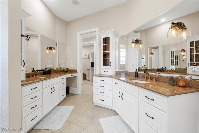 bathroom featuring tile patterned flooring and vanity