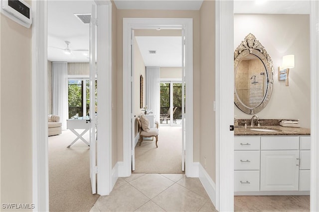 bathroom with vanity, tile patterned floors, plenty of natural light, and ceiling fan