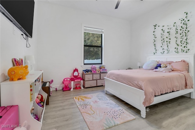 bedroom with ceiling fan and light wood-type flooring