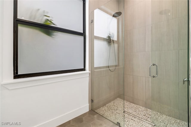 bathroom featuring tile patterned flooring and walk in shower