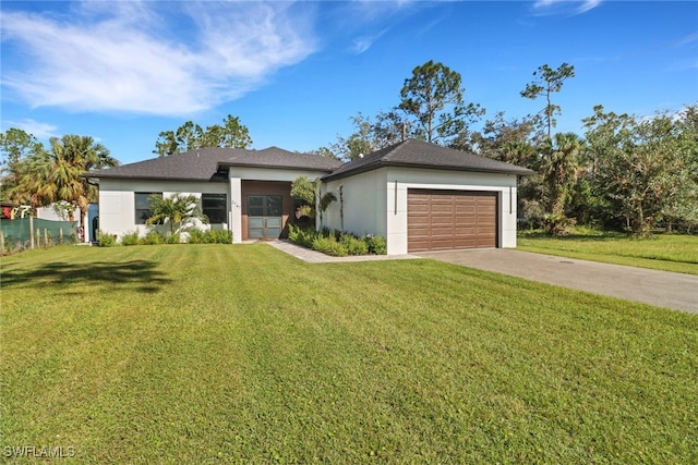 view of front facade with a front yard and a garage