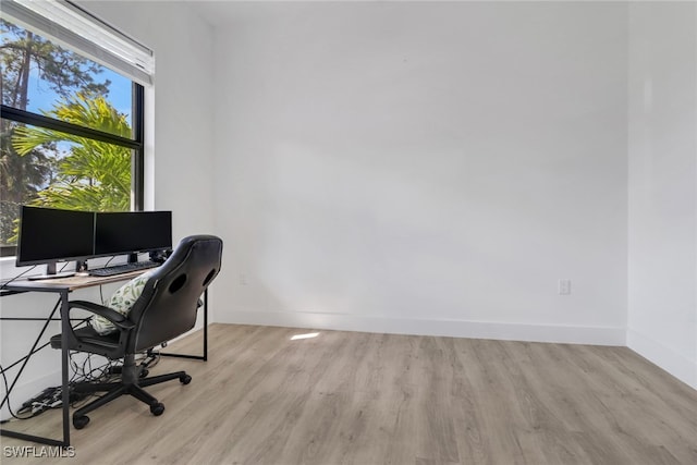 office space with light hardwood / wood-style flooring