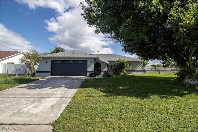 view of front of property with a garage and a front yard