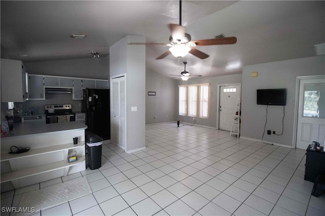 kitchen with ceiling fan, black fridge, lofted ceiling, electric stove, and light tile patterned flooring