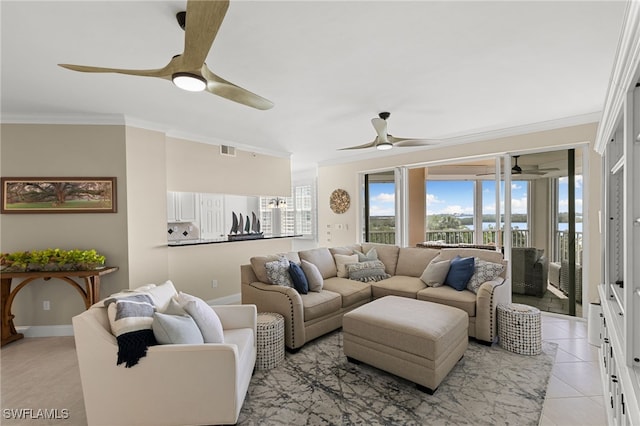 living room with crown molding, light tile patterned floors, and ceiling fan