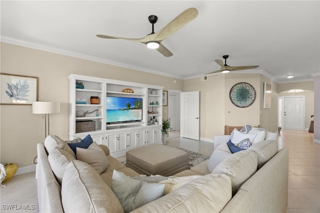 tiled living room with ceiling fan and crown molding